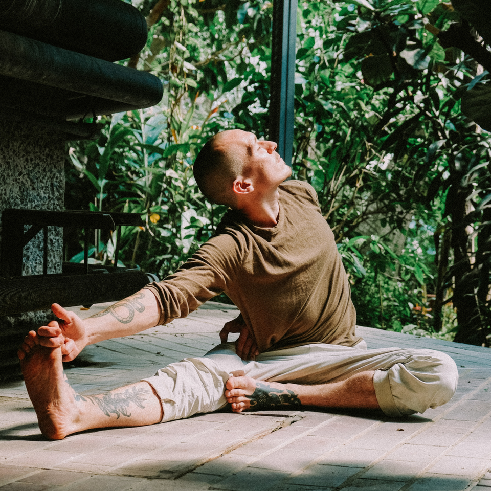 Man stretching during yoga and being mindful